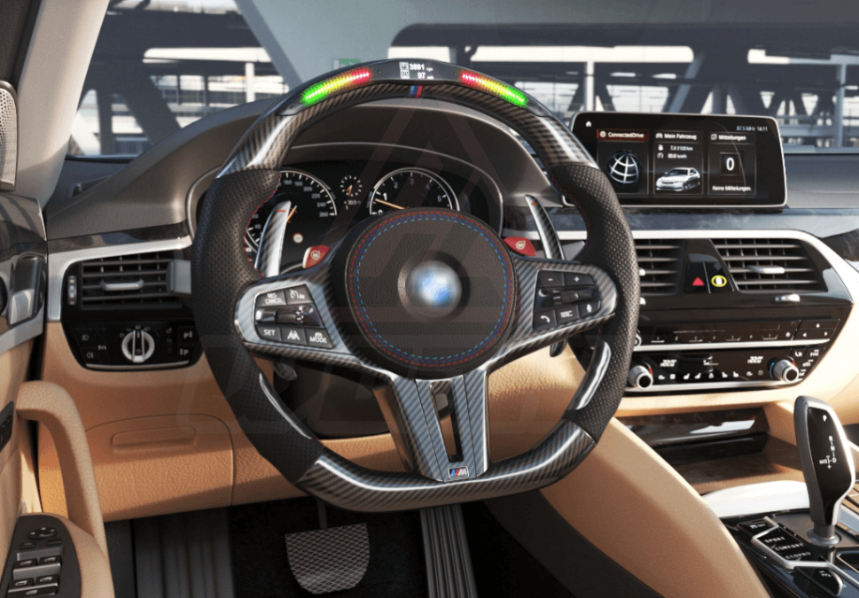 Side view of a BMW G/F chassis, M steering wheel in carbon fiber, black perforated leather, with driving assistant pro buttons, led shift lights and m color accents